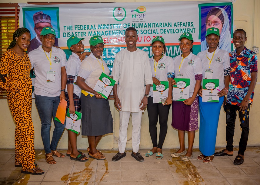 Pst. Edewor Egedegbe in group photograph with trainer and N-Skill Catering and Baking Beneficiaries, Delta State